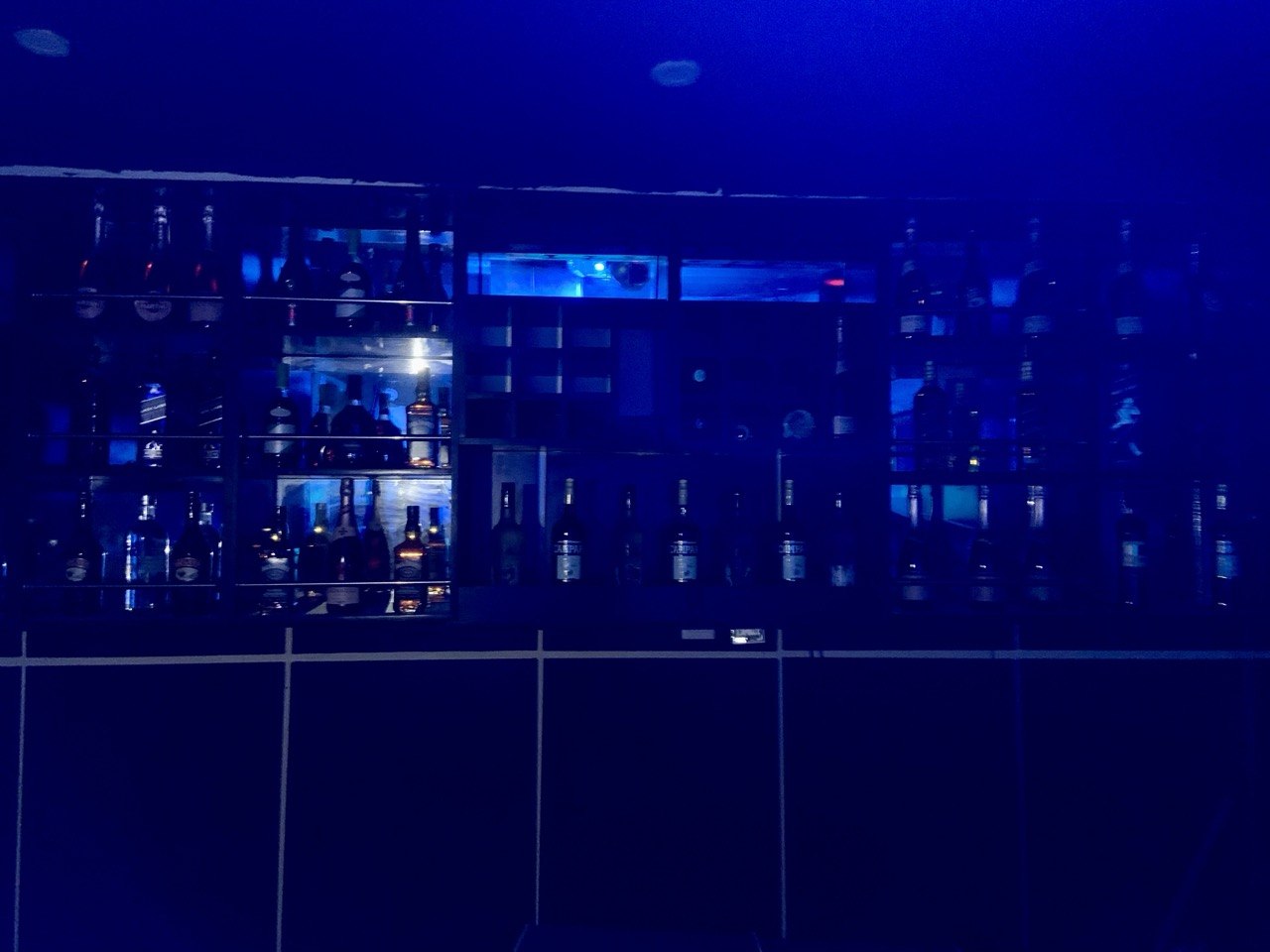 People playing snooker in a modern bar setting